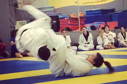 image of Elaine performing a flying armbar